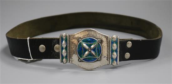 A George V Art Nouveau Liberty & Co planished silver and enamel buckle mounted on a leather belt, numbered 10107, buckle 82mm,.